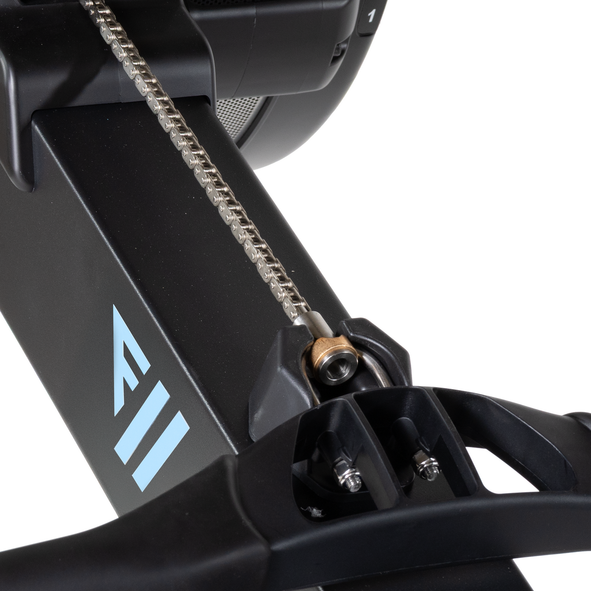 Close-up of a black exercise bike with a chain and 'E11' logo on a white background